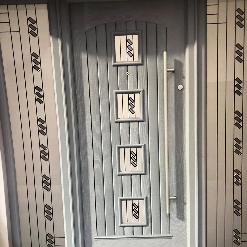 Modern front door with geometric glass panels, fitted by Ennis Glass